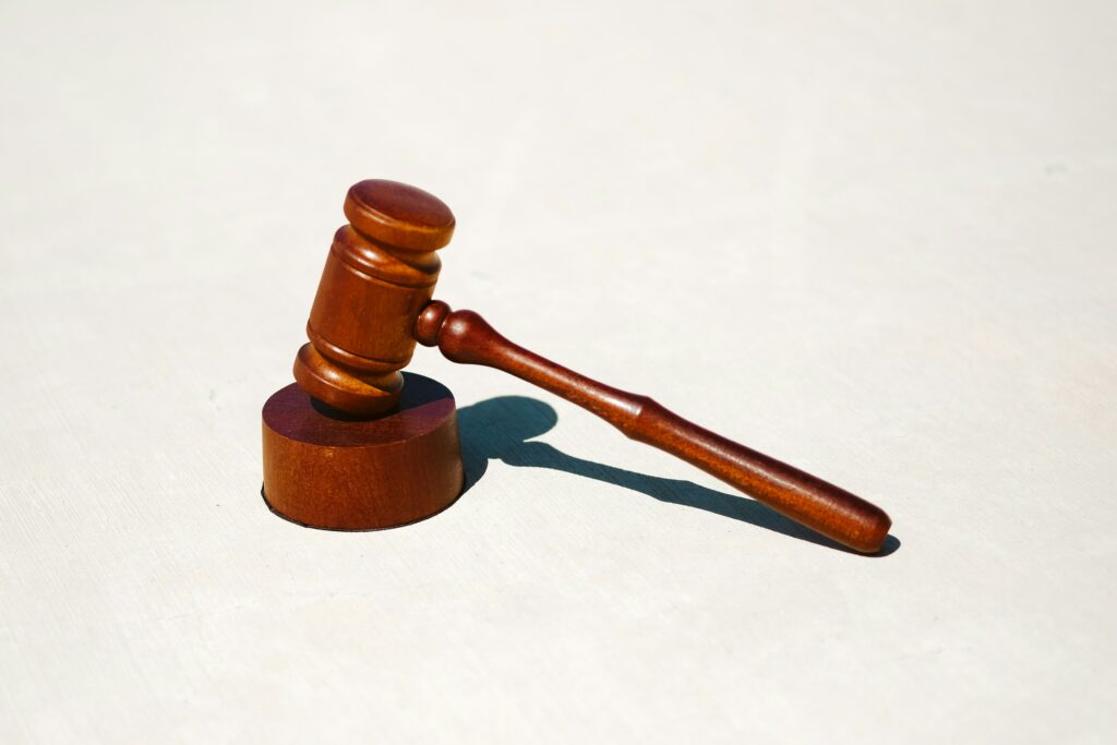 Wooden judge's gavel on a sound block, symbolizing court rulings in patent infringement cases